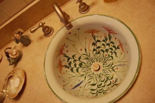 pottery craftsman sink in a 50s pink bathroom