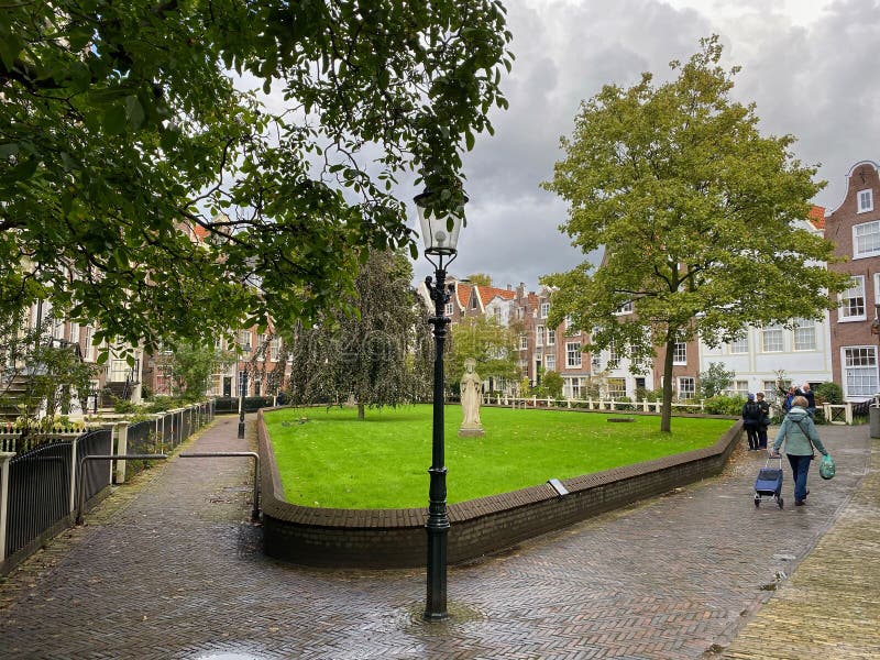 The Begijnhof is one of the oldest hofjes in Amsterdam. Amsterdam, Netherlands - October 3,2019:  The Begijnhof is one of the oldest hofjes in Amsterdam. A group royalty free stock photos