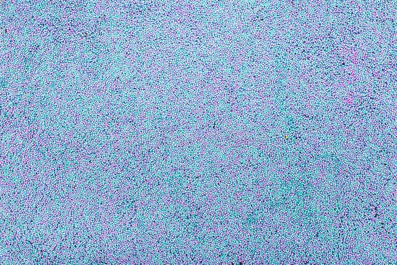 Background of children`s plasticine crumbs of blue and purple, copy space, texture. Background of children`s plasticine crumbs of blue and purple, copy space stock photography