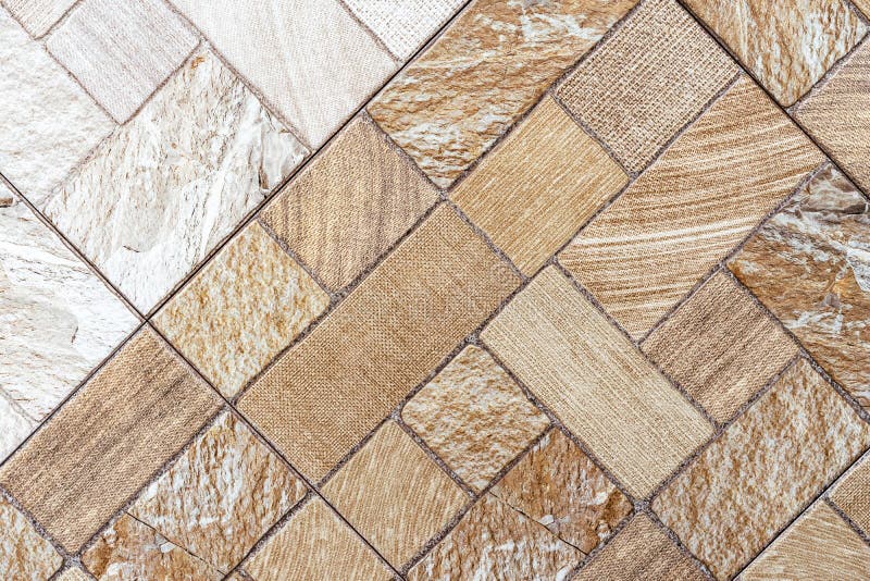 Beige and brown ceramic tiles with fabric texture.  royalty free stock photo