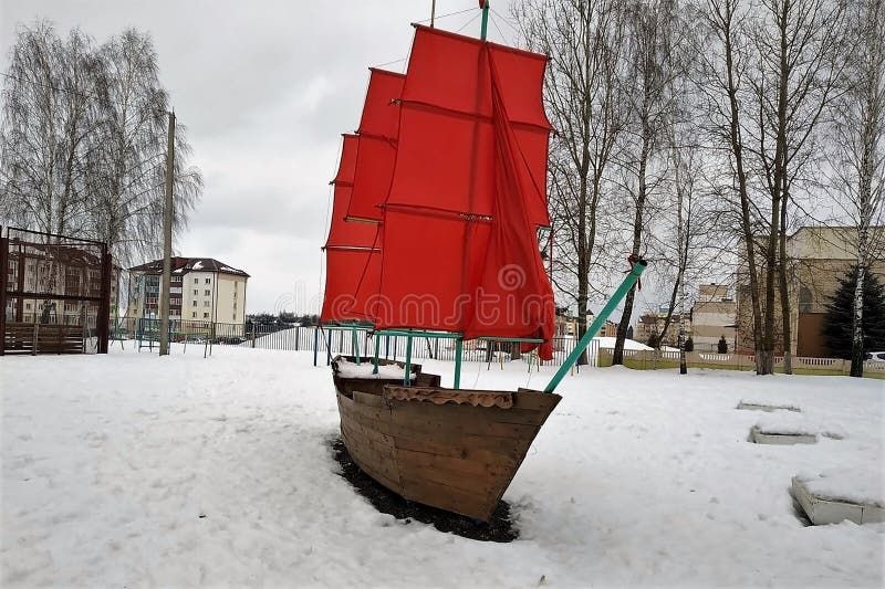 The boat with bright red sails, installation, design, a school court yard, winter, snow, stock image