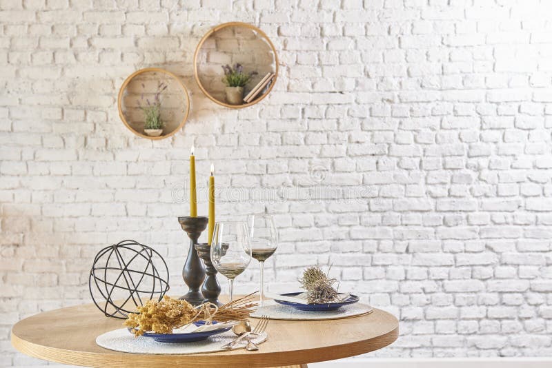 Brick wall interior with round frame and table royalty free stock image