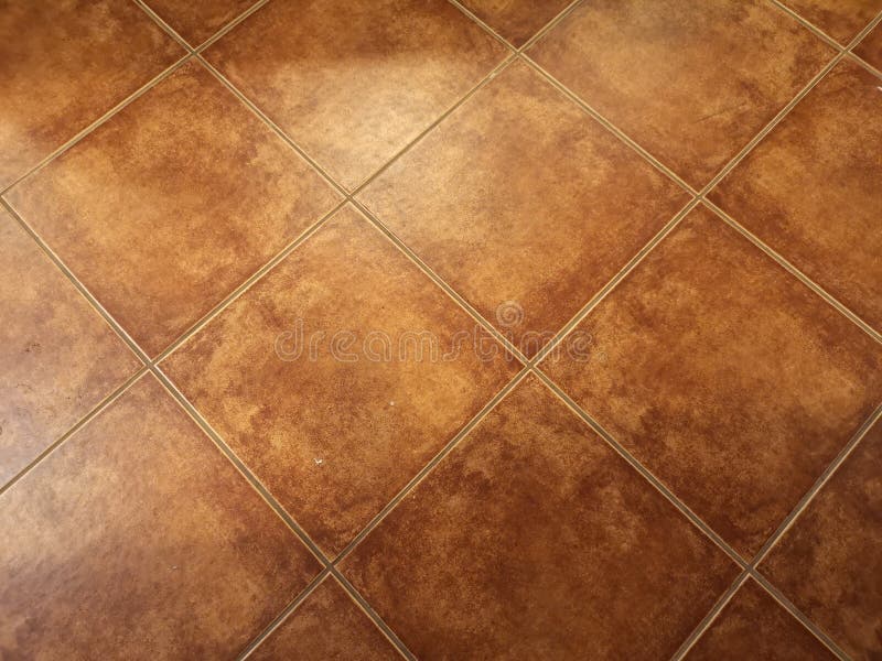 Brown glazed tiles texture material floor. Closeup Brown glazed tiles texture material floor grid royalty free stock images