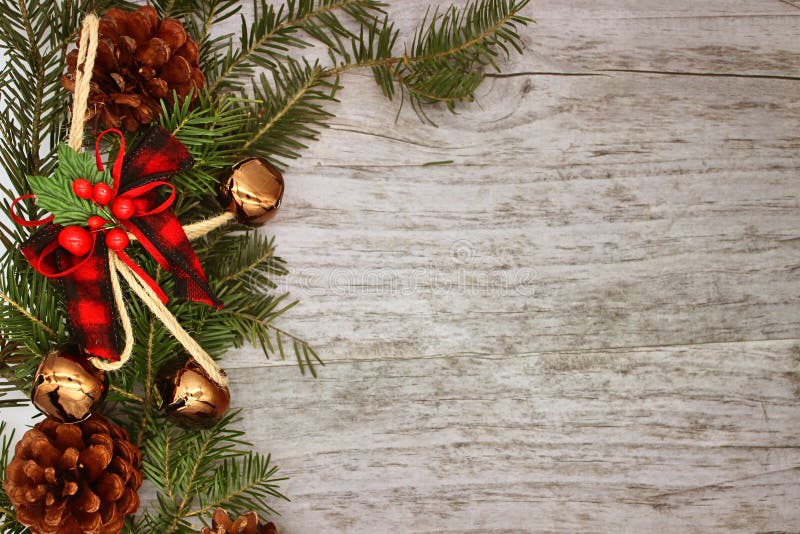 Christmas decorations - branches of coniferous trees with decorations on a wooden background.  stock photos