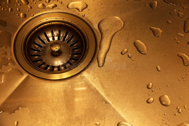 kitchen sink in retro style. drain hole and drops of water after washing dishes. stock photo