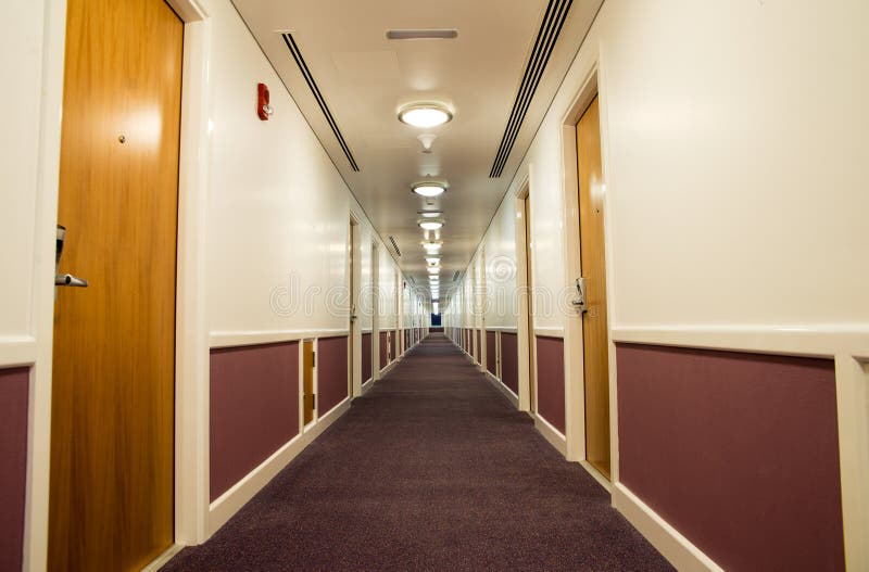 Corridor. Long corridor with wooden doors royalty free stock photo