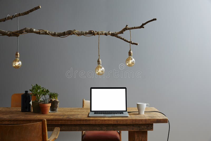 Creative workspace vintage design desk organic lamp design. Contrast between nature and high tech stock image