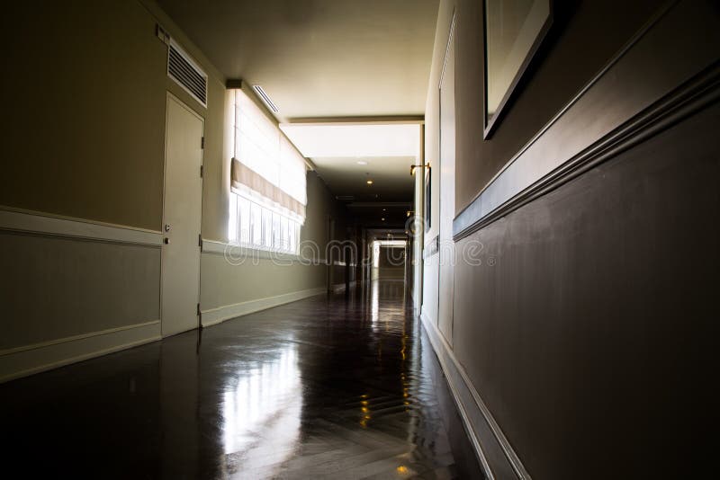 Dark and empty corridor with available natural light from window royalty free stock photos