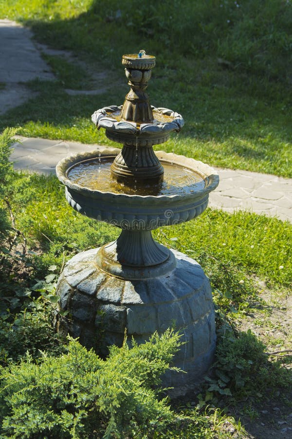 Decorative fountain in the courtyard of a private house. Decorative fountain in the courtyard royalty free stock images