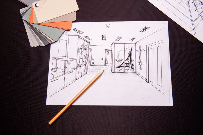 Drawing, selection of materials for the repair of apartments. Man draws drawing, selects materials for the repair of apartments. interior sketches, bedroom stock image