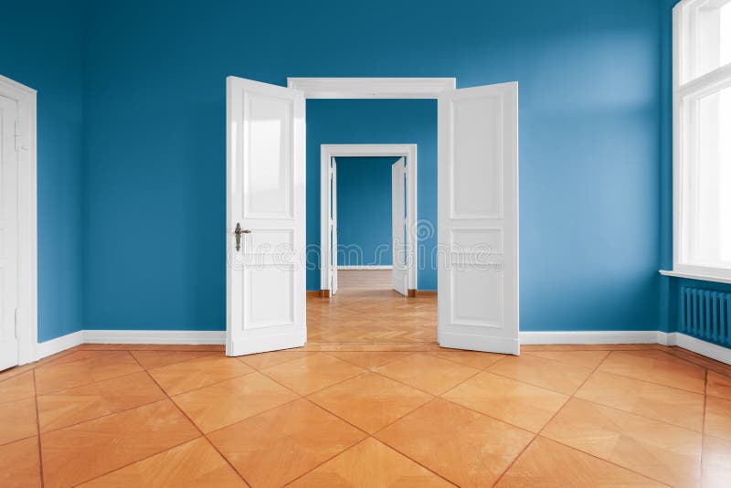 Empty apartment room with blue walls and parquet floor royalty free stock images