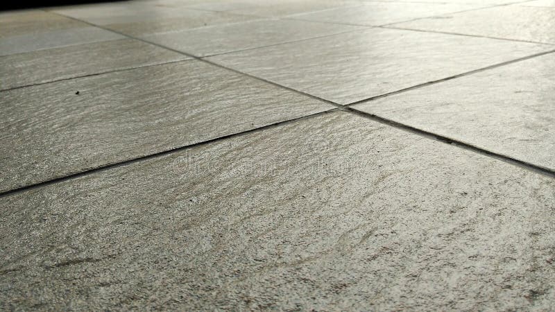 Gray tile floors background stock images