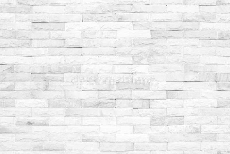 Grey and white brick wall texture background. Brickwork or stone. Work flooring interior rock old pattern clean concrete grid uneven bricks design stack stock photo