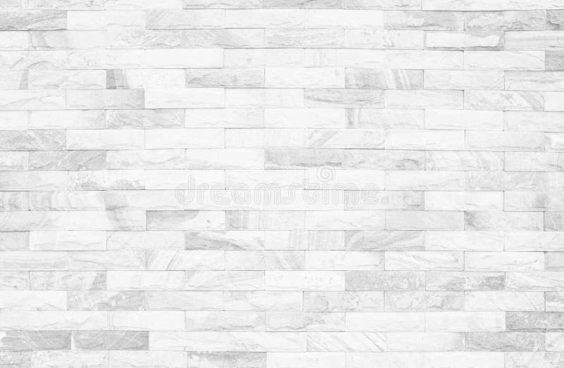 Grey and white brick wall texture background. Brickwork or stone. Work flooring interior rock old pattern clean concrete grid uneven bricks design stack royalty free stock photo