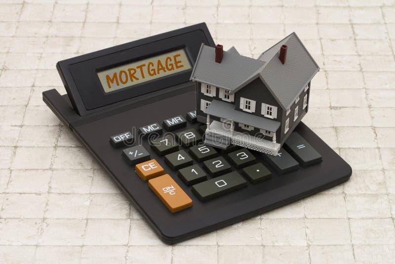 Home Mortgage, A gray house and calculator on stone background stock photo