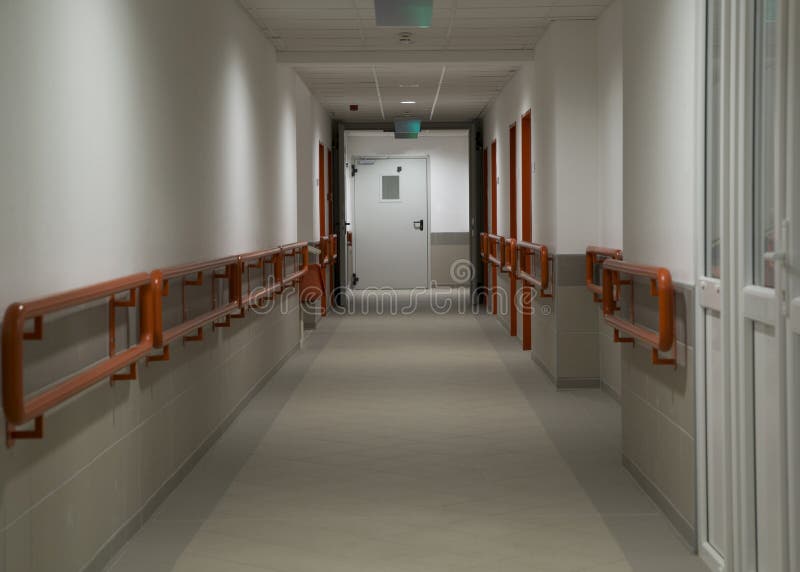 Hospital corridor. Longe hospital corridor with door royalty free stock photos