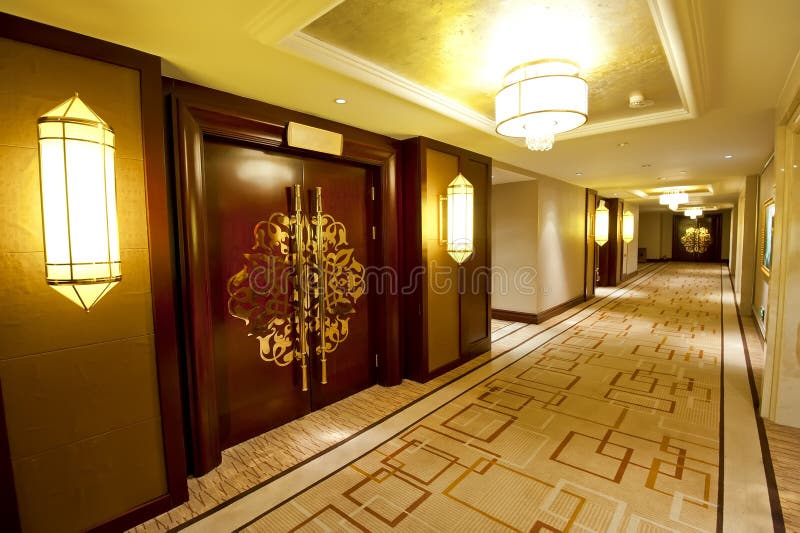 Hotel corridor. Luxury hotel corridor with decorative doors and lamps royalty free stock images