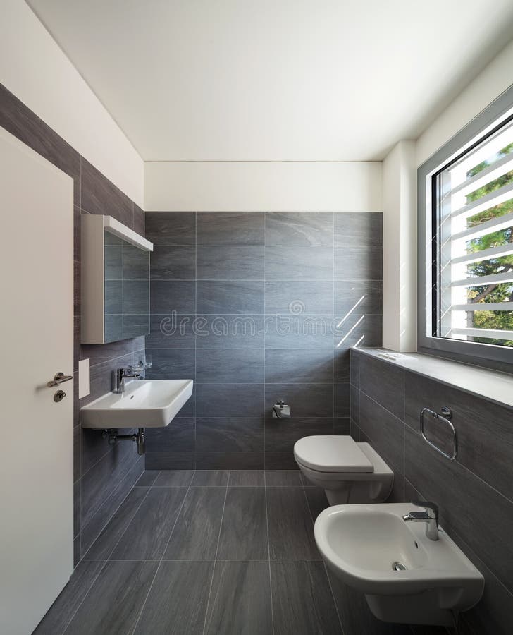 Interior of a modern house, gray bathroom stock photography