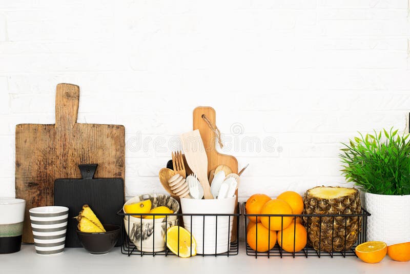 Kitchen shelf storage organization fruit cutlery. Home style minimalism zero waste. Still life with storage baskets of royalty free stock image