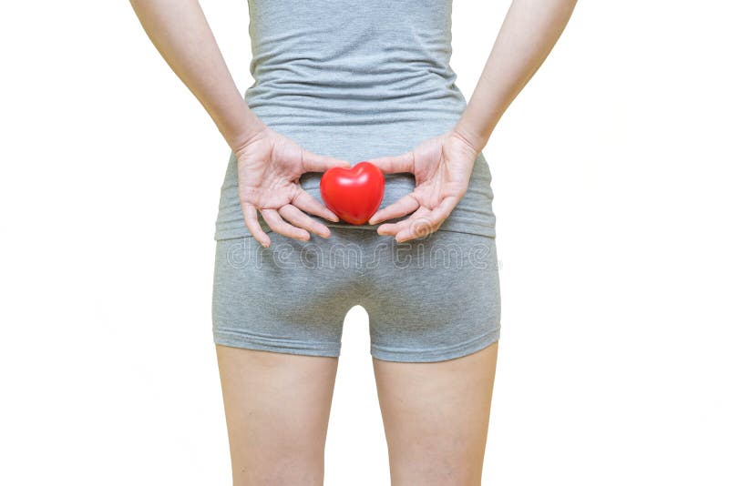 Low body of a woman in gray clothes put her hands and red heart on the bottom, Health-care concept on white background.  stock photography