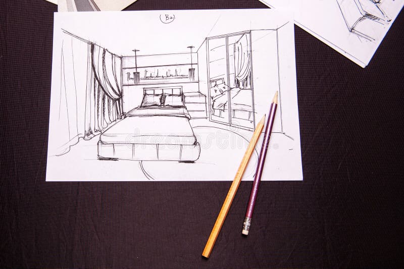 Drawing, selection of materials for the repair of apartments. Man draws drawing, selects materials for the repair of apartments. interior sketches, bedroom stock images