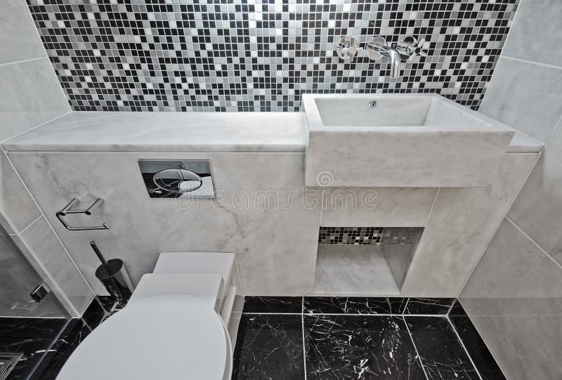 Marble bathroom with mosaic tiles. Modern luxury bathroom with marble hand wash basin and mosaic tiles stock image