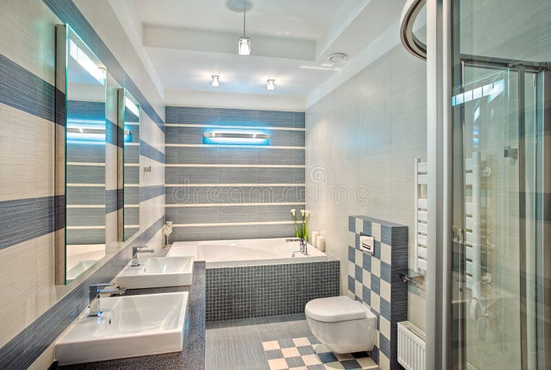 Modern bathroom in blue and gray tones with mosaic. On wide angle view stock photo