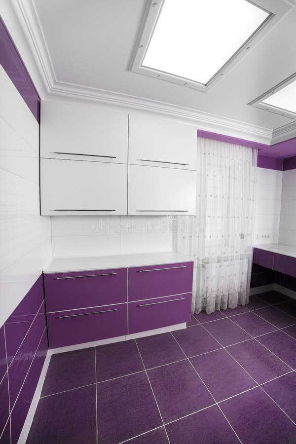 Modern Bathroom interior with a mosaic panel. White bathtub against violet and white wall royalty free stock images