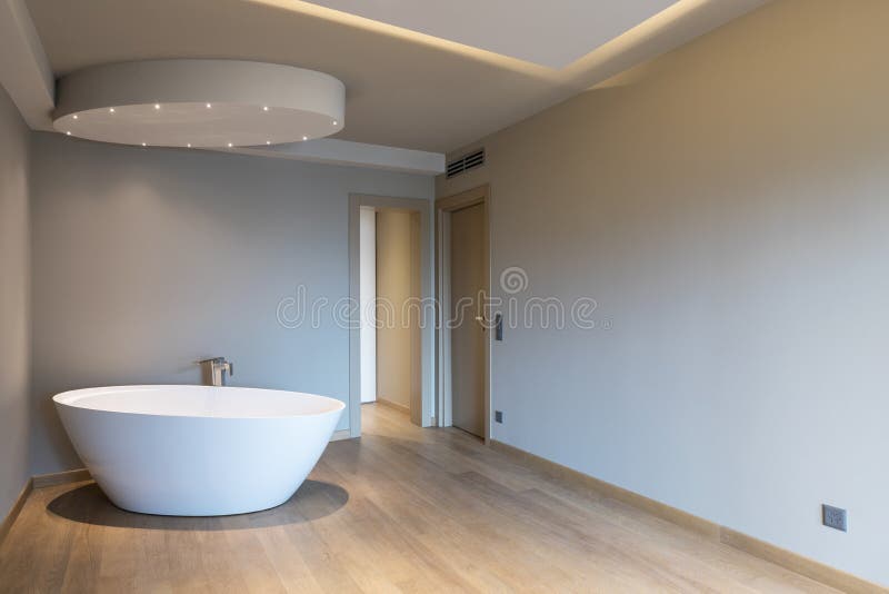 Modern bedroom with bathtub, luxury apartment. Nobody inside stock photo