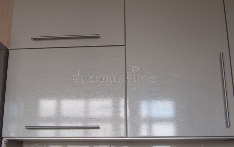 Modern kitchen wall Cabinet silver in the interior of the kitchen in the style of minimalism royalty free stock photos