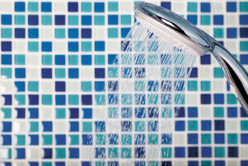 Mosaic in the bathroom. Shower on the background mosaic in the bathroom royalty free stock image