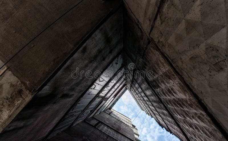 Old gray tall building without people bottom view. Old gray tall building without people in Ukraine Donbass bottom view stock photos