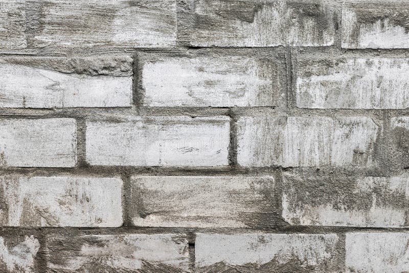 Old white brickwork. Background of old white brickwork smeared cement texture close-up view royalty free stock photos