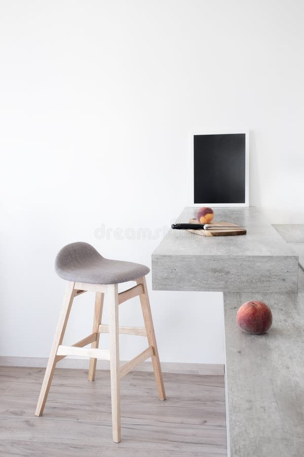 Part of modern scandinavian style kitchen: bar counter with bar counter and peaches. royalty free stock photo