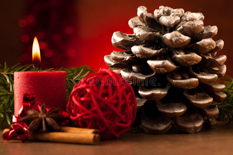 Pine cone and candle cristmas decoration stock photos