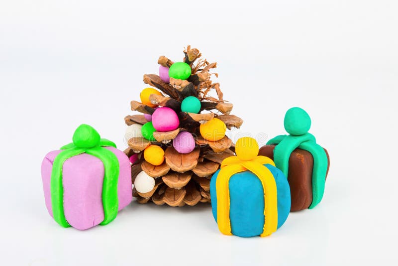 Pine cone and plasticine. Pine cone and plasticine gift. Stock image macro royalty free stock photo