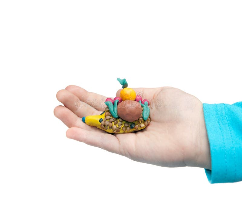 Plasticine. Hedgehog in the hands royalty free stock photo