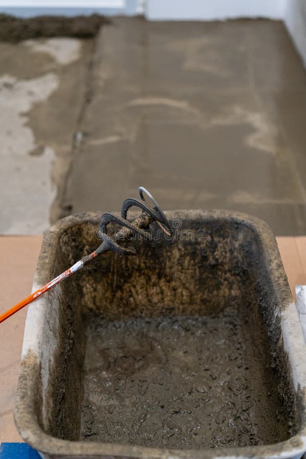 Repair and decoration of apartments. pouring screed on the floor.  stock images