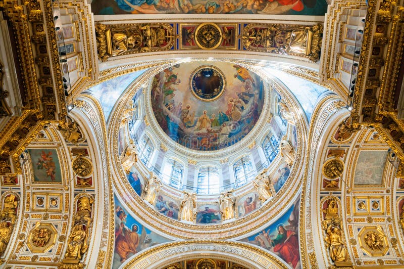 Saint Petersburg, Russia. Highly ornated ceiling with windows of the central dome of St Isaac Cathedral royalty free stock photos