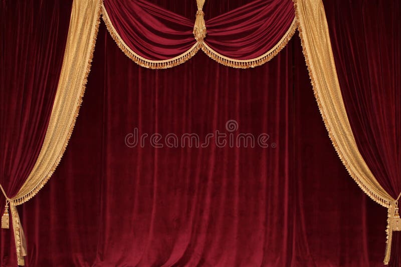 Scarlet velvet curtains with lambrequin and gold fringe. In vintage style royalty free stock image