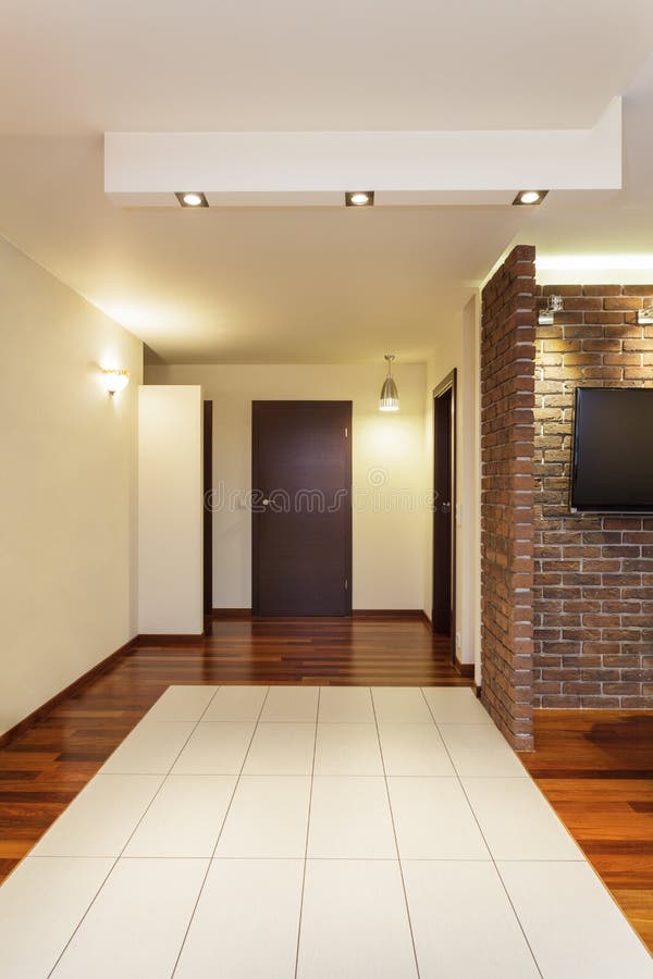 Spacious apartment - corridor. And brown wooden door stock images