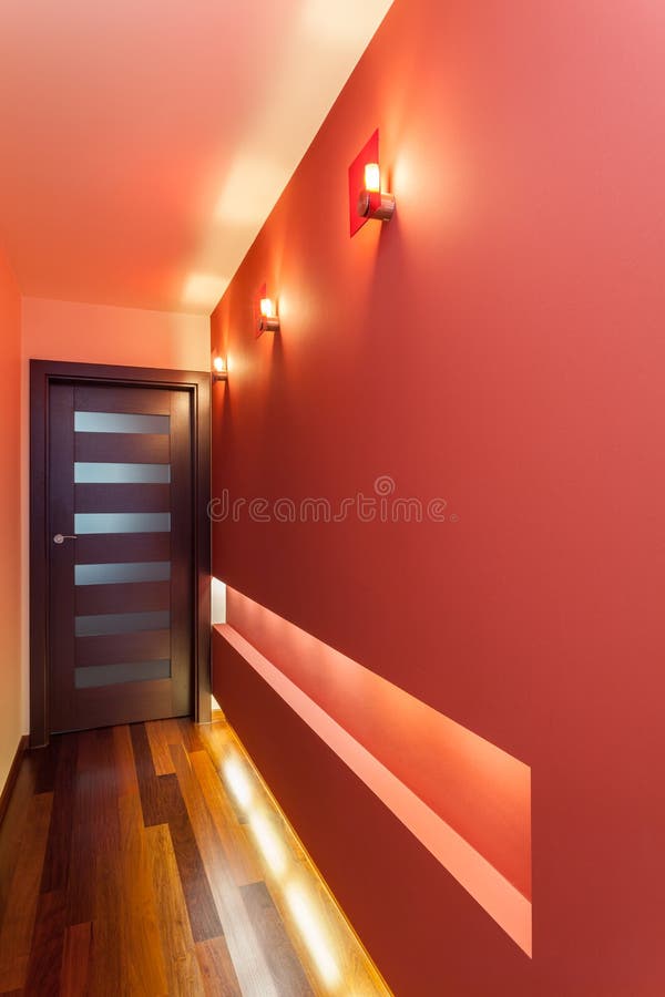Spacious apartment - Corridor. Spacious apartment - Long and red corridor royalty free stock photos