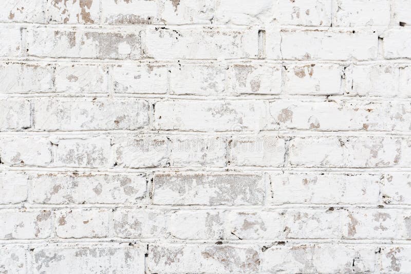 Texture painted old brick wall, damaged uneven brickwork, abstract background. White texture painted old brick wall, damaged uneven brickwork, abstract royalty free stock photo