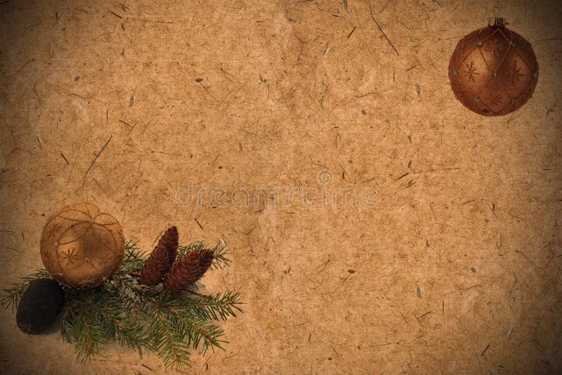 Textured old grunge paper background with pine cones, coniferous. Twig and Christmas tree balls with copy space for text stock images