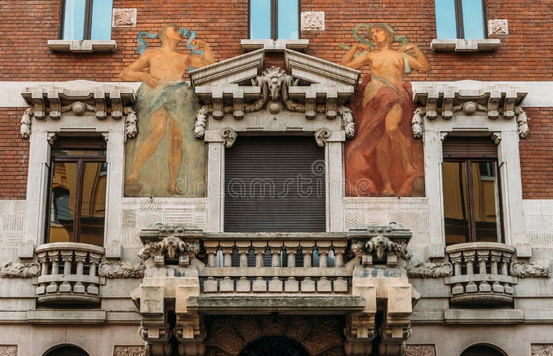 Turn of the 20th century Art Nouveau architecture and humanist wall mural at Milan`s Porta Venezia district, Lombardy, Italy. Milan, Italy - May 24, 2018: Turn royalty free stock image