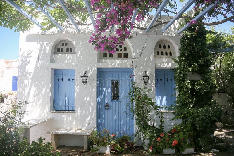 Typical greek island whitewashed house veranda in Tinos, Greece royalty free stock photo