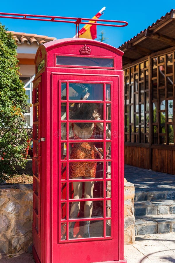 View of the English telephone booth in province Guadalajara, Spain. Copy space for text. Vertical. royalty free stock photos